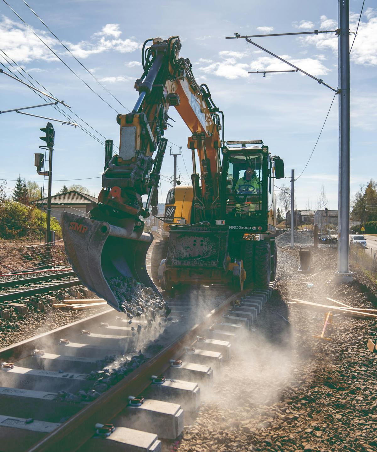 Excavator on train tracks